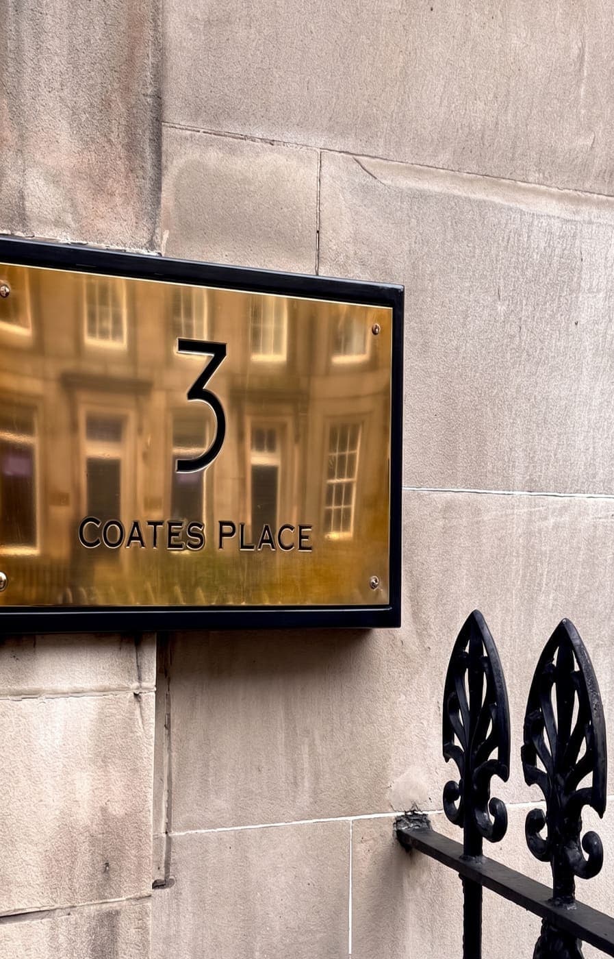 The brass plaque reading 3 Coates Place